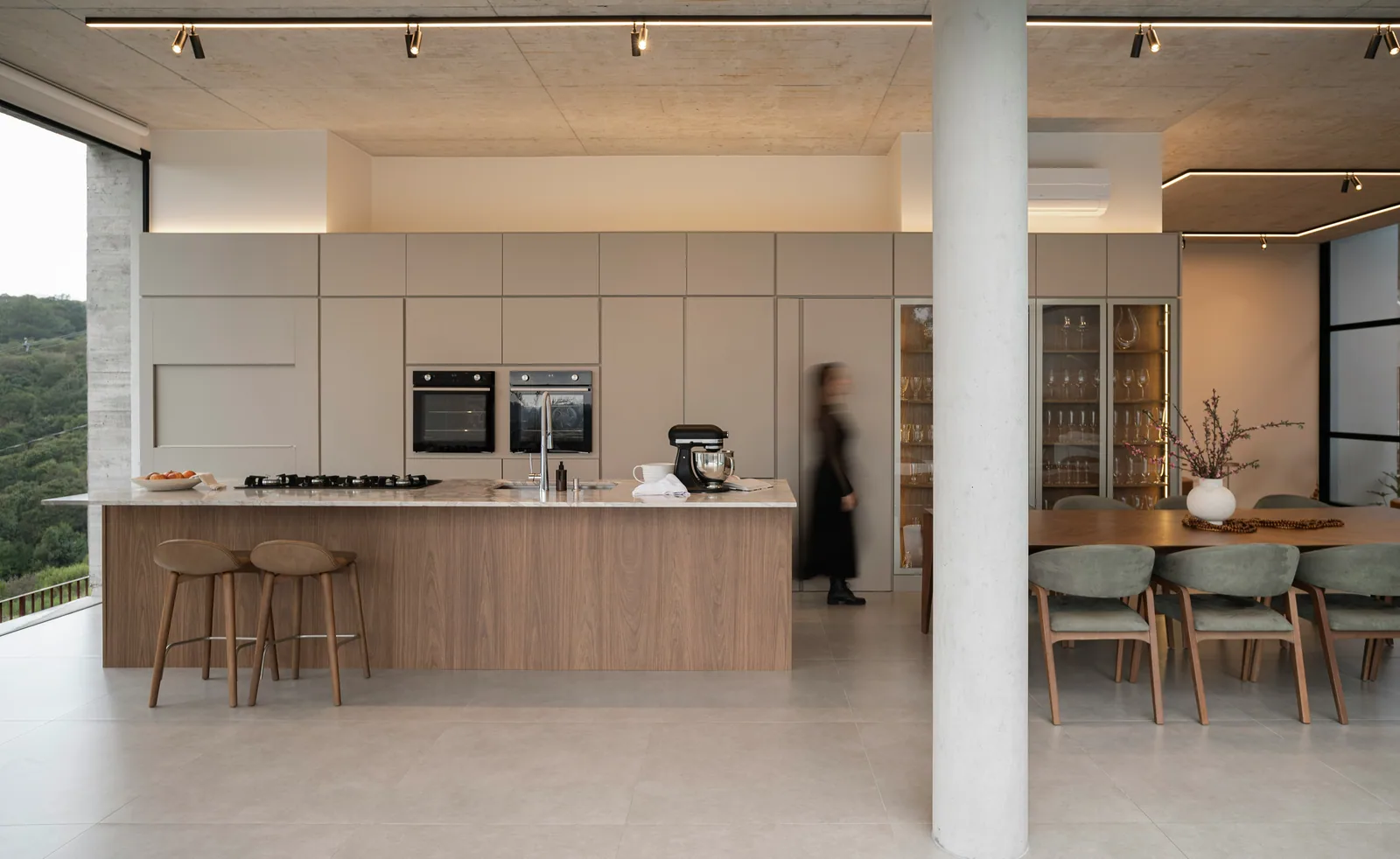 Modern kitchen and dining area with large windows
