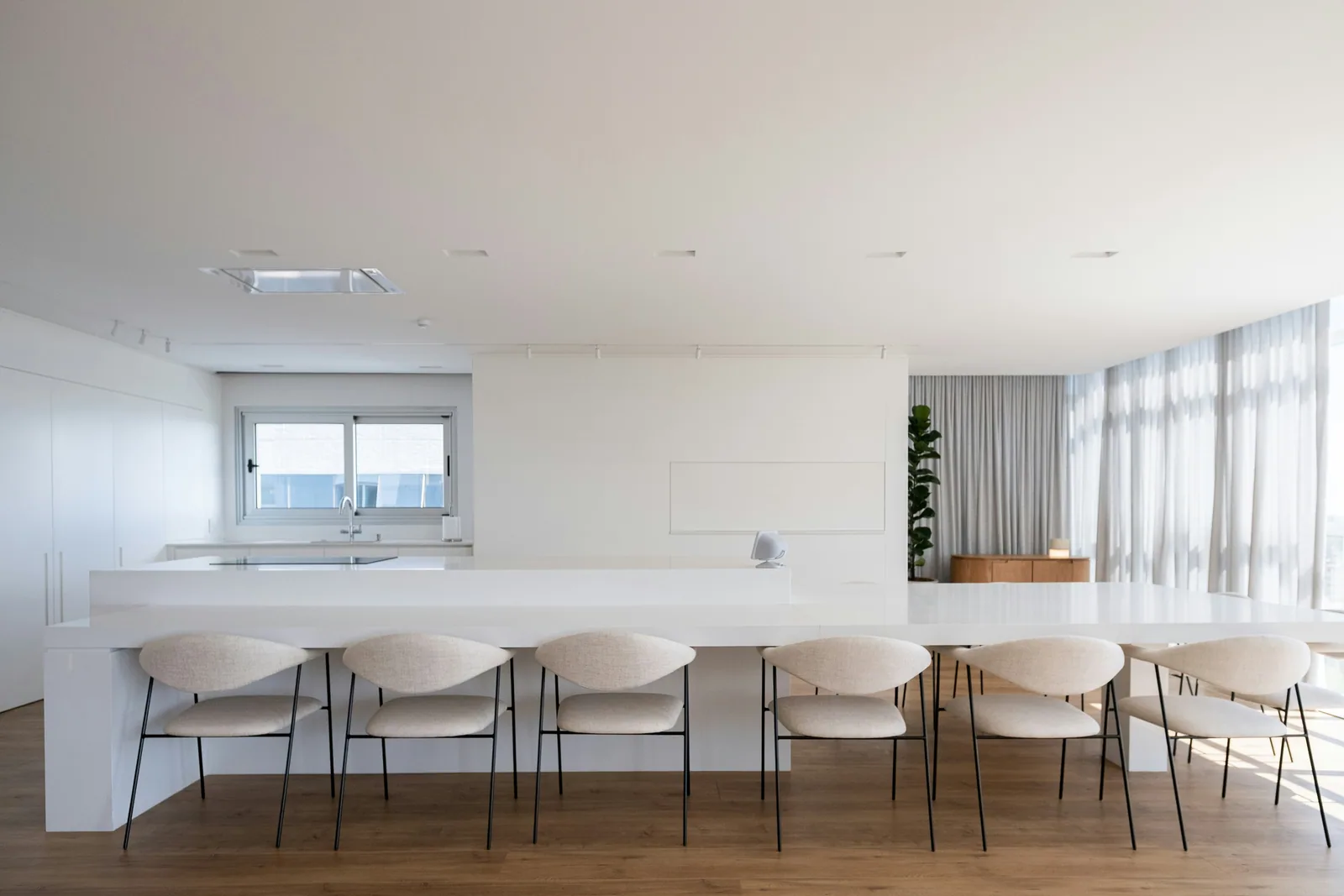 Modern white kitchen island with chairs and chairs