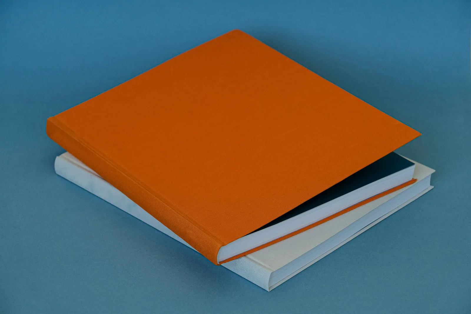 A stack of three books sitting on top of each other