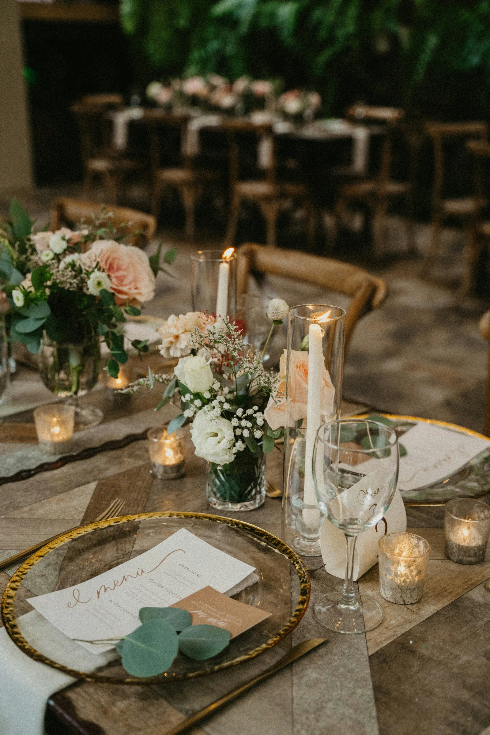 A table is set with candles and flowers