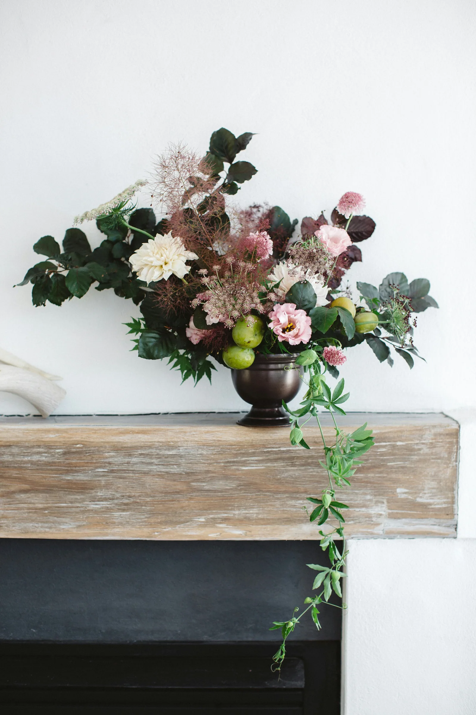Red and white flowers on brown wooden table