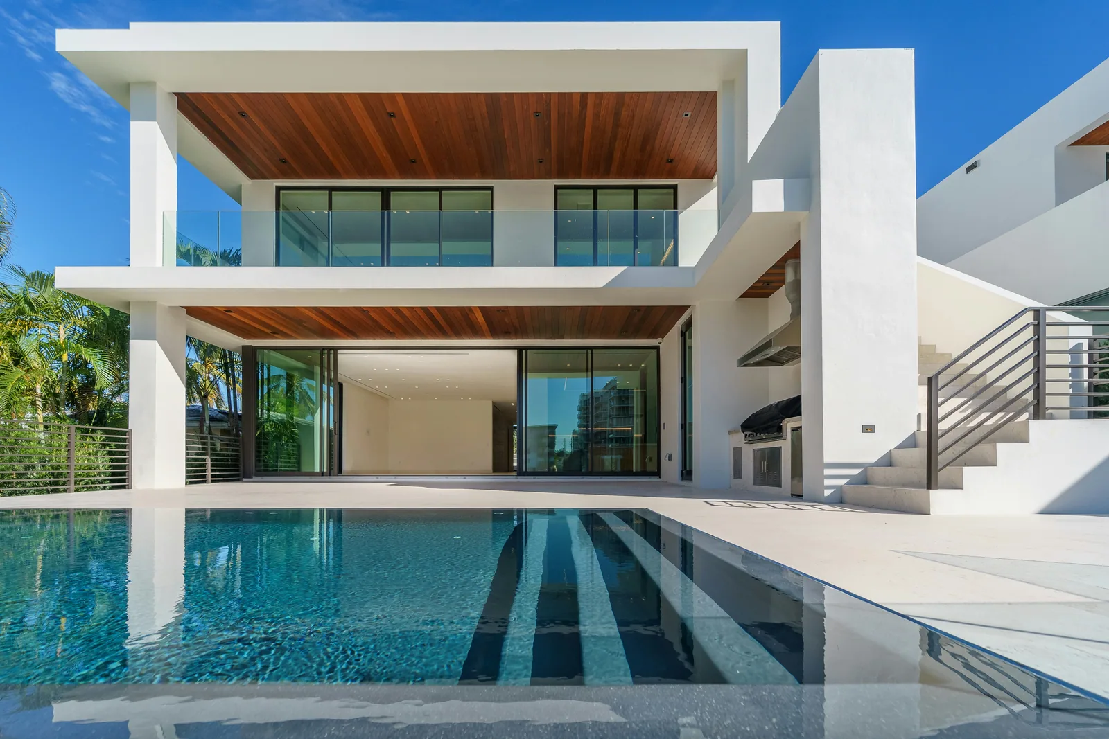 A white modern house under a blue sky